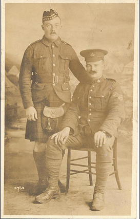 Private Moore (seated) with Private Lloyd S. Neff (standing).