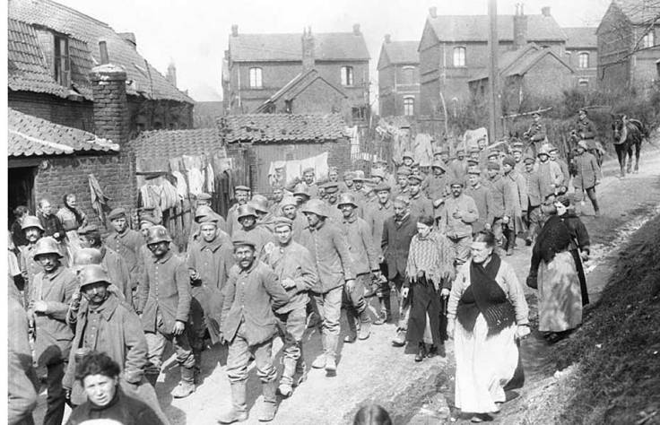 German captured by Canadians at Vimy Ridge passing through a French Village in 1917. Canada. Dept. of National Defence, Library and Archvies Canada.